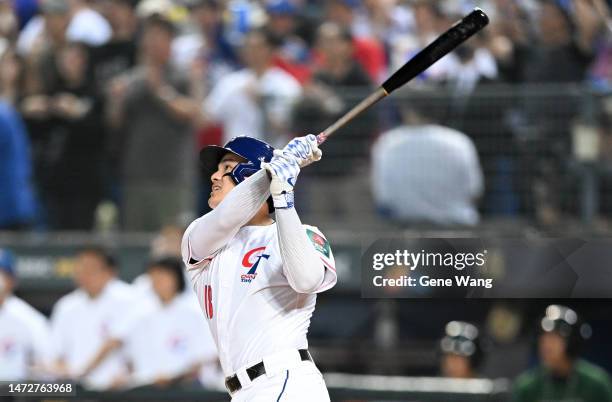 Yu Chang of Chinese Taipei hits a grand slam at the bottom of the 2nd inning during the World Baseball Classic Pool A game between Netherlands and...