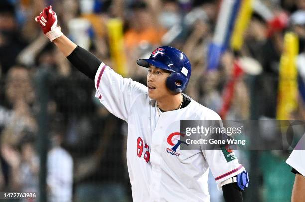 Li Lin of Chinese Taipei hits a RBI single to tie the game at the bottom of the 2nd inning during the World Baseball Classic Pool A game between...