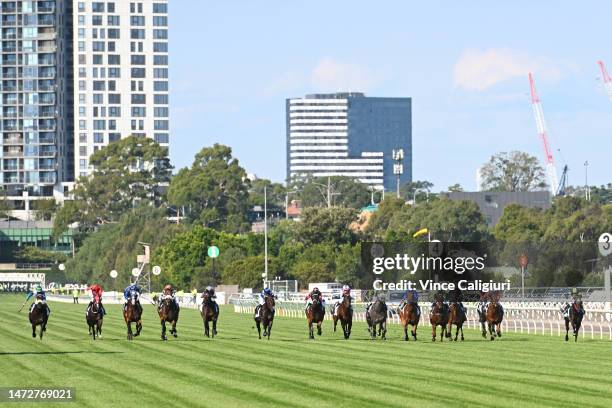 Dean Holland riding In Secret defeats Lofty Strike and I Wish I Win in Race 7, the Yulong Stud Newmarket Handicap, during Melbourne Racing at...