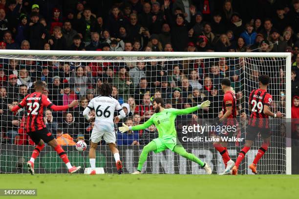 Philip Billing of AFC Bournemouth scores the team's first goal past Alisson Becker of Liverpool during the Premier League match between AFC...