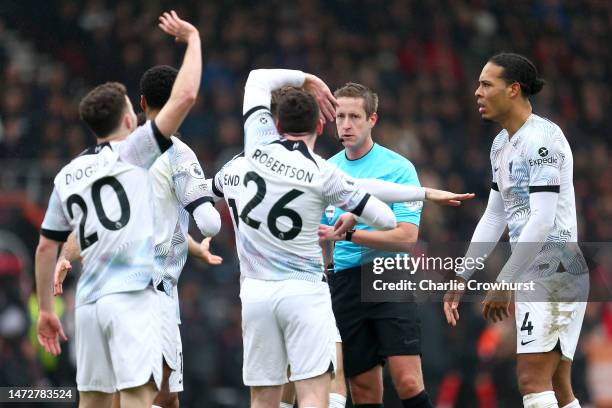 Liverpool players appeal for a penalty towards Referee John Brooks, which is later given during the Premier League match between AFC Bournemouth and...