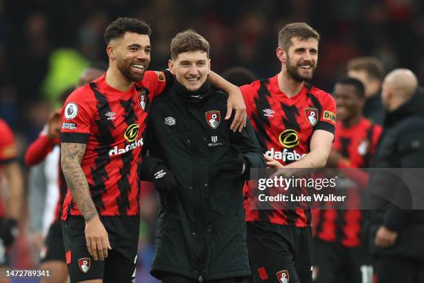 David Brooks of AFC Bournemouth applauds the fans with teammates Ryan Fredericks and Jack Stephens after the team's victory in the Premier League...