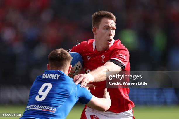 Liam Williams of Wales is challenged by Stephen Varney of Italy, before scoring the team's second try, during the Six Nations Rugby match between...