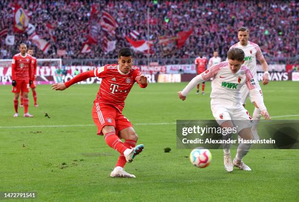 Joao Cancelo of FC Bayern Munich scores the team's first goal during the Bundesliga match between FC Bayern Muenchen and FC Augsburg at Allianz Arena...