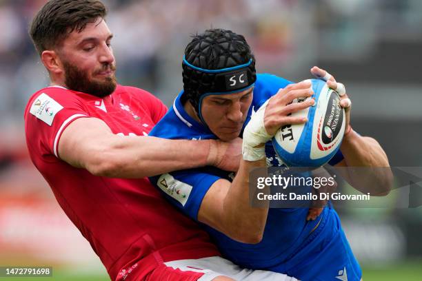 Juan Ignacio Brex of Italy is tackled byOwen Williams of Wales during the Six Nations Rugby match between Italy and Wales at Stadio Olimpico on March...