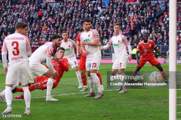 Benjamin Pavard of FC Bayern Munich scores the team's second goal during the Bundesliga match between FC Bayern Muenchen and FC Augsburg at Allianz...