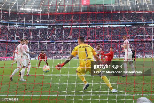 Benjamin Pavard of FC Bayern Munich scores the team's second goal during the Bundesliga match between FC Bayern Muenchen and FC Augsburg at Allianz...