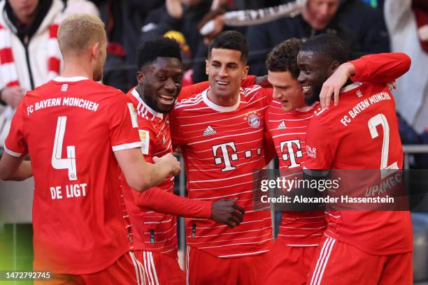 Benjamin Pavard of FC Bayern Munich celebrates with teammates after scoring the team's second goal during the Bundesliga match between FC Bayern...