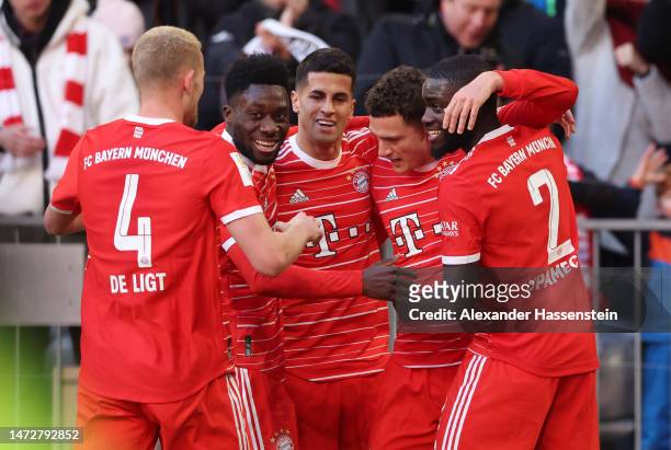 Benjamin Pavard of FC Bayern Munich celebrates with teammates after scoring the team's second goal during the Bundesliga match between FC Bayern...