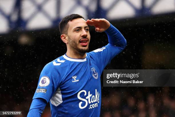 Dwight McNeil of Everton celebrates after scoring the team's first goal during the Premier League match between Everton FC and Brentford FC at...