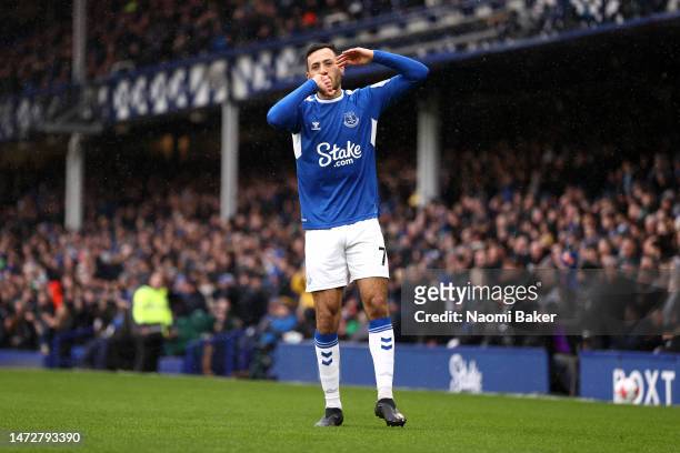 Dwight McNeil of Everton celebrates after scoring the team's first goal during the Premier League match between Everton FC and Brentford FC at...
