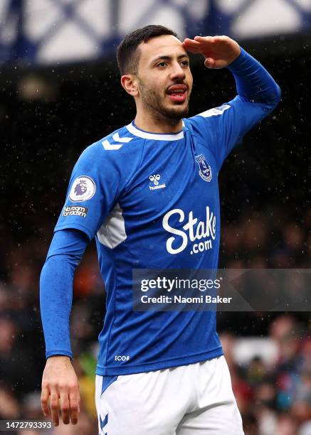 Dwight McNeil of Everton celebrates after scoring the team's first goal during the Premier League match between Everton FC and Brentford FC at...