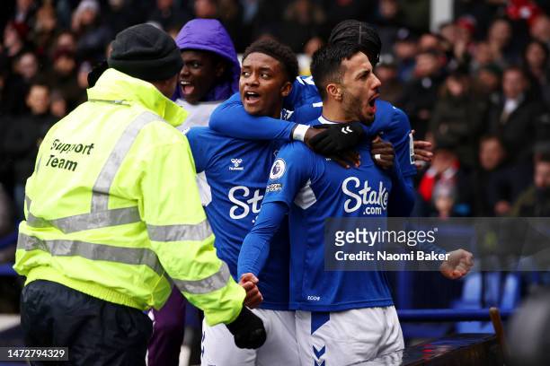 Dwight McNeil of Everton celebrates after scoring the team's first goal during the Premier League match between Everton FC and Brentford FC at...