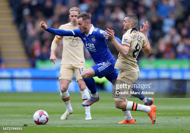 James Maddison of Leicester City is challenged by Mateo Kovacic of Chelsea during the Premier League match between Leicester City and Chelsea FC at...