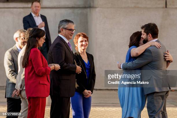 Minister Secretary-General of the Presidency Ana Lya Uriarte accompanied by a group of ministers hugs the President of Chile Gabriel Boric before...