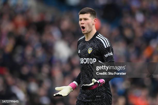 Illan Meslier of Leeds United celebrates after teammate Patrick Bamford scores the team's first goal during the Premier League match between Leeds...