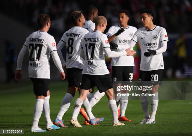 Sebastian Rode of Eintracht Frankfurt celebrates with teammates after scoring the team's first goal during the Bundesliga match between Eintracht...