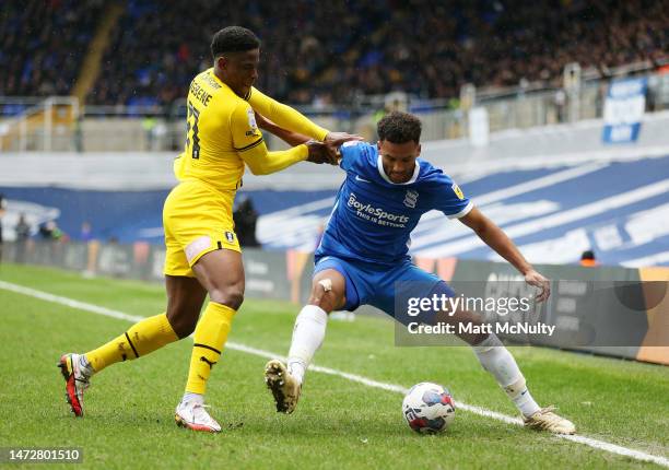 Auston Trusty of Birmingham City battles for possession with Chiedozie Ogbene of Rotherham United during the Sky Bet Championship between Birmingham...