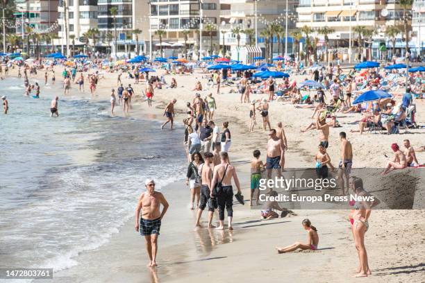 Numerous people bathe and sunbathe on the Poniente beach, on 11 March, 2023 in Benidorm, Alicante, Valencian Community, Spain. During this weekend,...