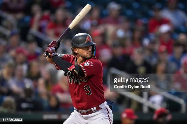 Jake Hager of the Arizona Diamondbacks bats in the second inning against the Cincinnati Reds during a spring training game at Goodyear Ballpark on...
