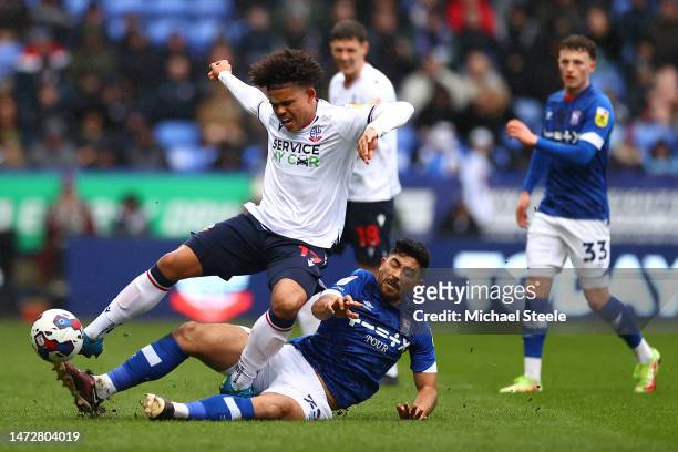 Shola Shoretire of Bolton Wanderers is fouled by Massimo Luongo of Ipswich Town during the Sky Bet League One between Bolton Wanderers and Ipswich...