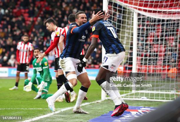Carlton Morris of Luton Town celebrates with Elijah Adebayo after scoring the team's first goal during the Sky Bet Championship between Sheffield...
