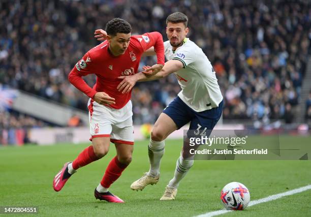 Brennan Johnson of Nottingham Forest battles for possession with Clement Lenglet of Tottenham Hotspur during the Premier League match between...