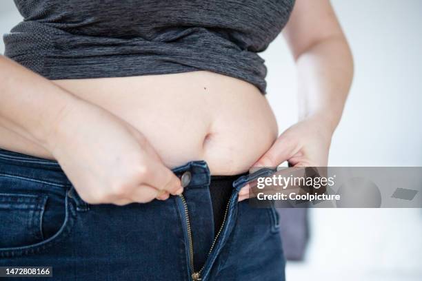 health  - overweight - jeans stock pictures, royalty-free photos & images