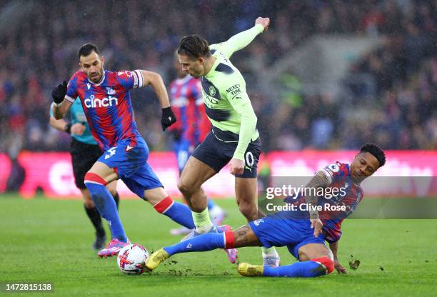 Jack Grealish of Manchester City is challenged by Nathaniel Clyne of Crystal Palace during the Premier League match between Crystal Palace and...