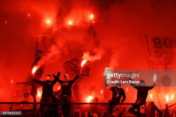 Borussia Dortmund fans release flares during the Bundesliga match between FC Schalke 04 and Borussia Dortmund at Veltins-Arena on March 11, 2023 in...