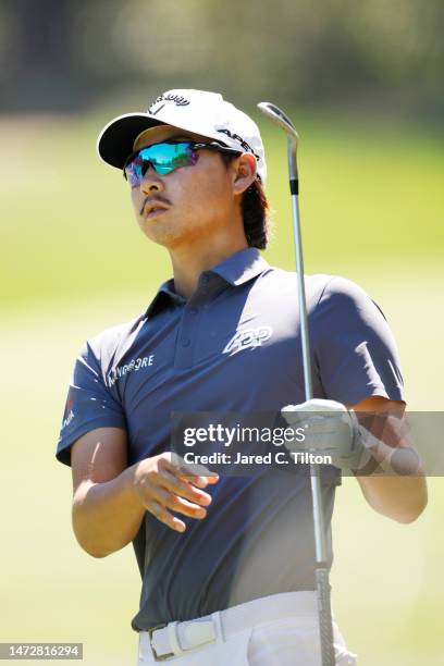 Min Woo Lee of Australia watches his approach shot on the first fairway during the third round of THE PLAYERS Championship on THE PLAYERS Stadium...