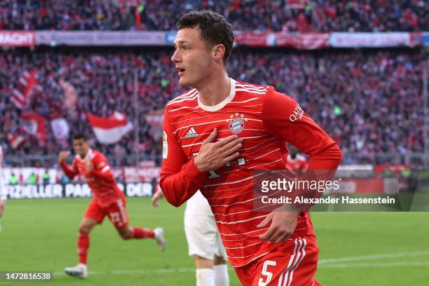 Benjamin Pavard of FC Bayern Munich celebrates after scoring the team's third goal during the Bundesliga match between FC Bayern Muenchen and FC...