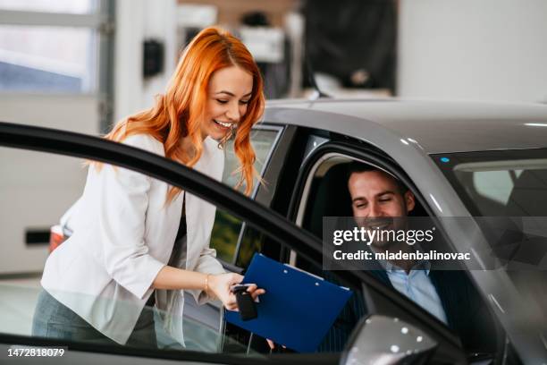 car dealership business. - geneva international motor show stock pictures, royalty-free photos & images