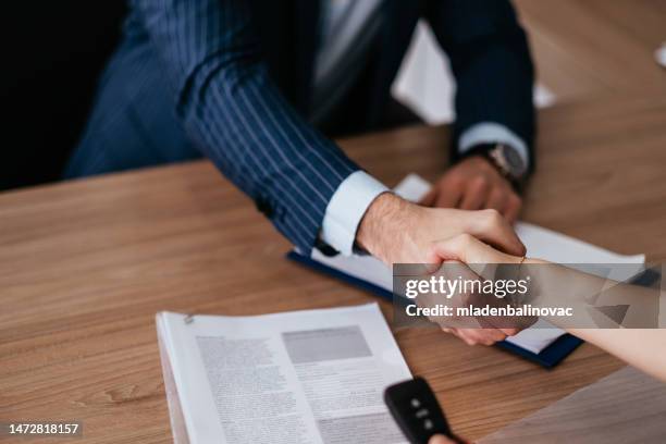 successful deal in a car showroom! - deal signing stockfoto's en -beelden