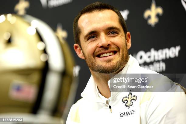 Quarterback Derek Carr of the New Orleans Saints speaks to members of the media after signing a four-year contract with the Saints at New Orleans...