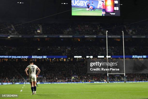 Marcus Smith of England looks dejected as the LED board shows the final scoreline, England 10 - 52 France, during the Guinness Six Nations Rugby...