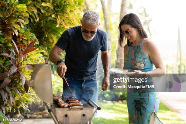 barbecue in the backyard - geographical locations stock pictures, royalty-free photos & images