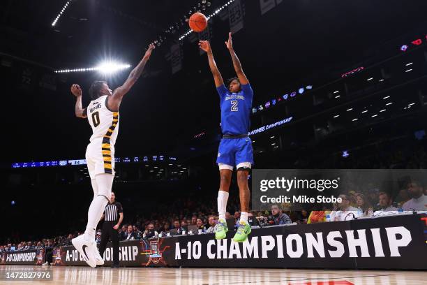 Larry Hughes Jr. #2 of the Saint Louis Billikens makes a three point basket against the Virginia Commonwealth Rams in the first half during the...