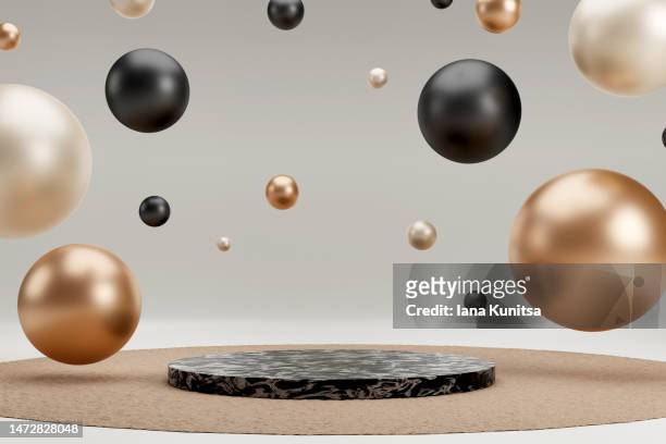 podium and black, gold, beige 3d spheres, circles on gray background. platform for showing products. trendy natural colors. - metallic balloons stock pictures, royalty-free photos & images
