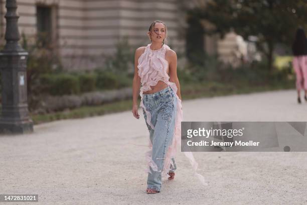 Carla Ginola seen wearing a semi sheer pastel pink tulle top, an oversized jeans with sequins and high heels before the Zimmermann show on March 06,...