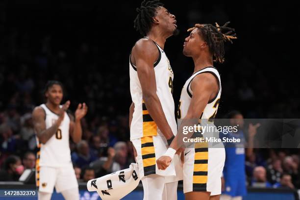Jayden Nunn of the Virginia Commonwealth Rams celebrates with Jalen DeLoach after a call against the Saint Louis Billikens in the second half during...