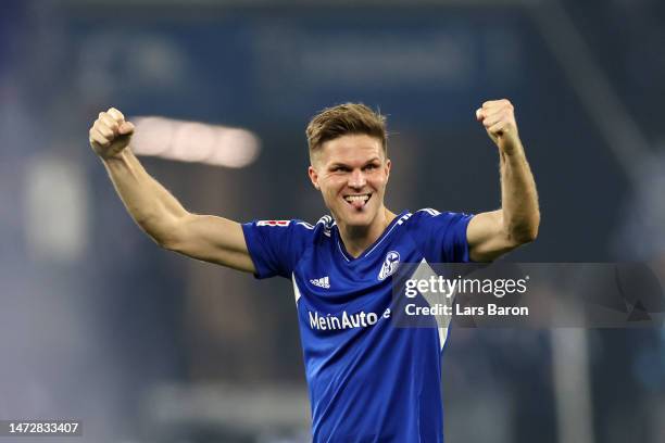 Marius Buelter of FC Schalke 04 celebrates following the Bundesliga match between FC Schalke 04 and Borussia Dortmund at Veltins-Arena on March 11,...