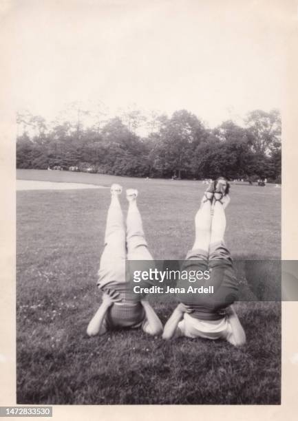 funny vintage photo friends having fun 1950s friendship sisters young at heart concept rear view butts - vintage 1950s woman stock pictures, royalty-free photos & images