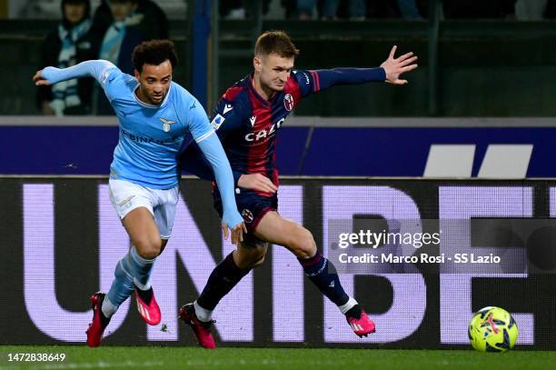 Felipe Anderson of SS Lazio competes for the ball with Stefan Posch of Bologna FC during the Serie A match between Bologna FC and SS Lazio at Stadio...