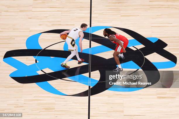 Braden Smith of the Purdue Boilermakers is defended by Bruce Thornton of the Ohio State Buckeyes during the first half in the semifinals of the Big...