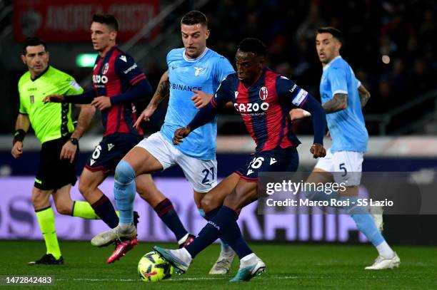 Sergej Milinkovic Savic of SS Lazio competes for the ball with Jhon Locumi of Bologna FC during the Serie A match between Bologna FC and SS Lazio at...