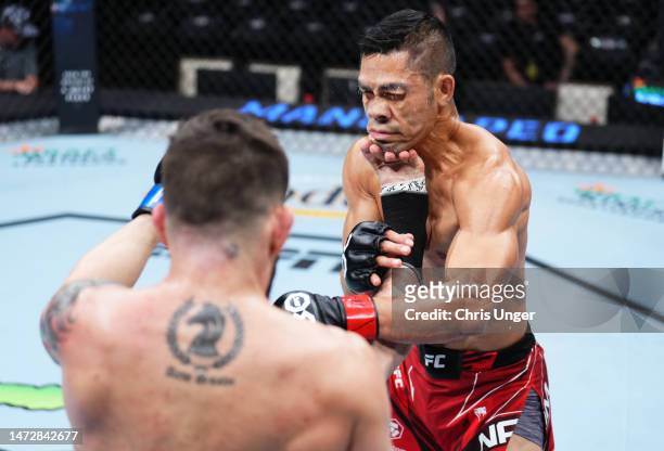 Bruno Silva of Brazil kicks Tyson Nam in a flyweight fight during the UFC Fight Night event at The Theater at Virgin Hotels Las Vegas on March 11,...