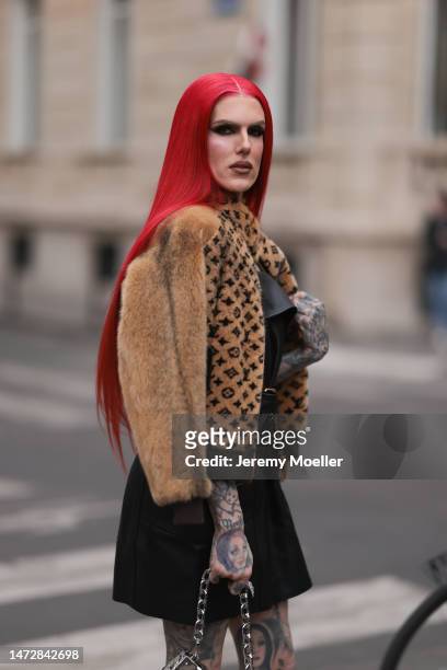 Jeffree Star is seen wearing a brown fur coat, Louis Vuitton jacket, black skirt and silver chain bag outside the Louis Vuitton show during Paris...