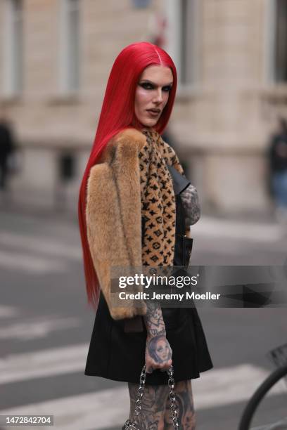 Jeffree Star is seen wearing a brown fur coat, Louis Vuitton jacket, black skirt and silver chain bag outside the Louis Vuitton show during Paris...