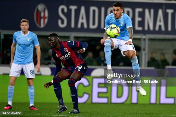 Matias Vecino of SS Lazio compete for the ball with Musa Barrow of Bologna FC during the Serie A match between Bologna FC and SS Lazio at Stadio...